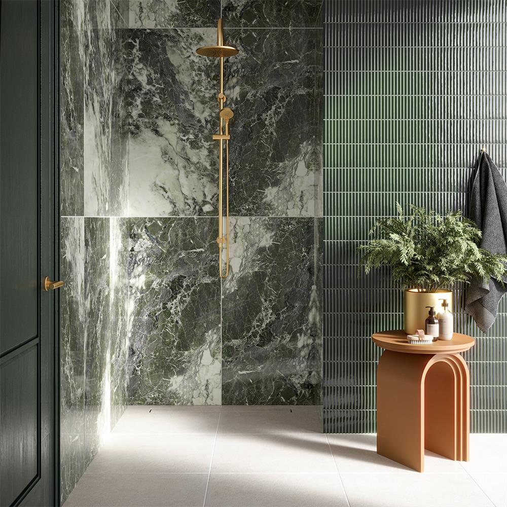 Green marble and matching kit kat tiles in a modern bathroom